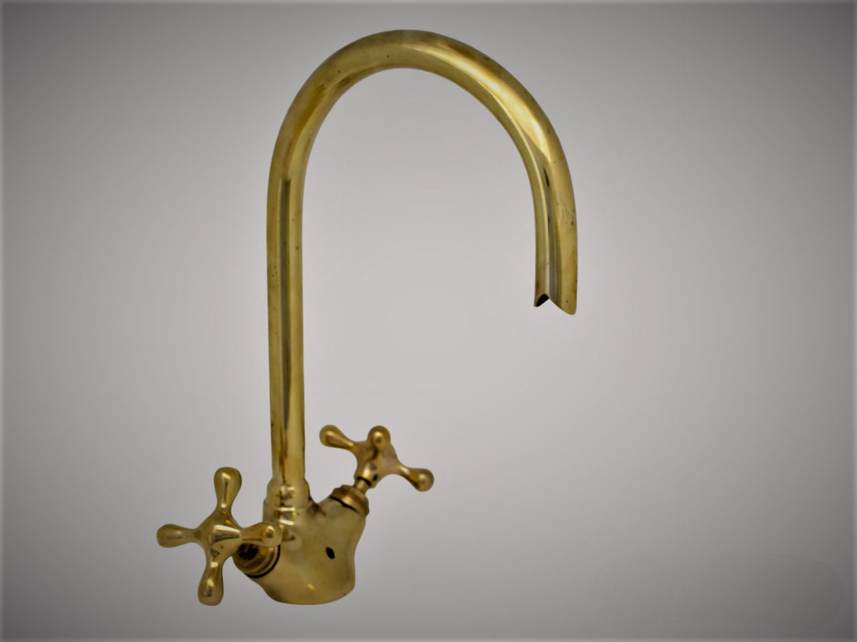 Unlaquered brass bathroom faucet