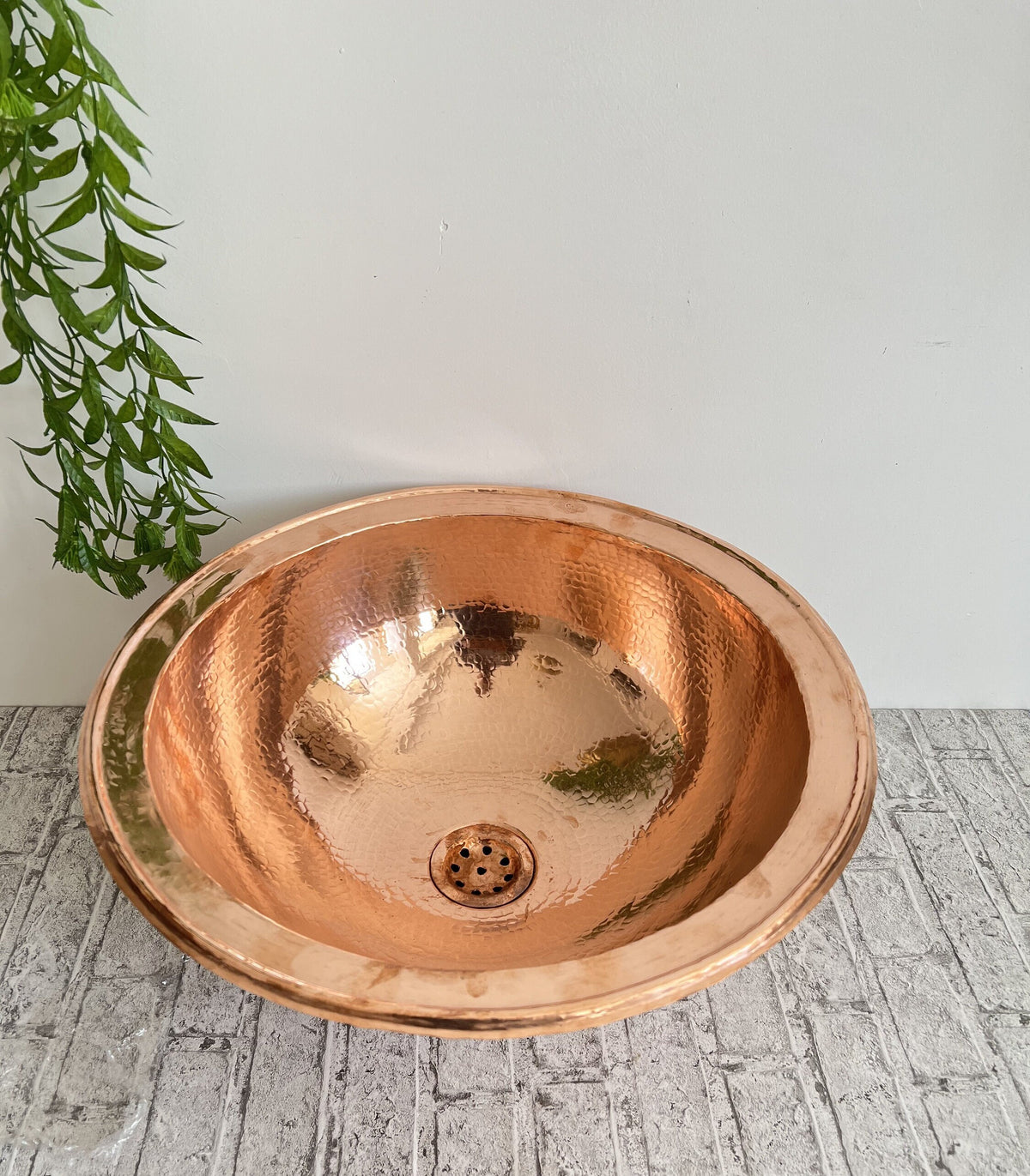 Indulge in the timeless charm of our antique brass sink, a masterpiece meticulously crafted by skilled artisans