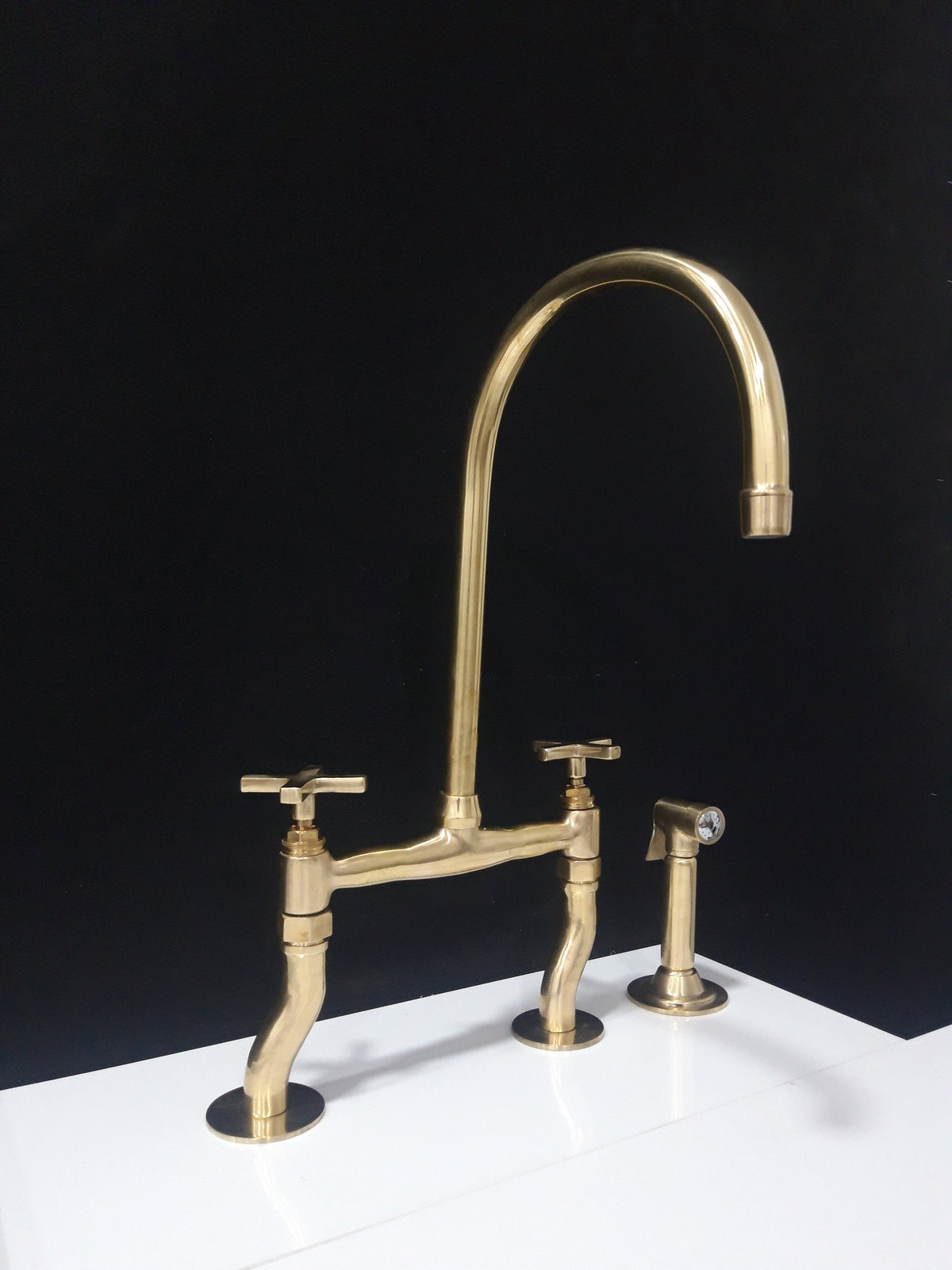 Unlacquered brass bridge kitchen faucet