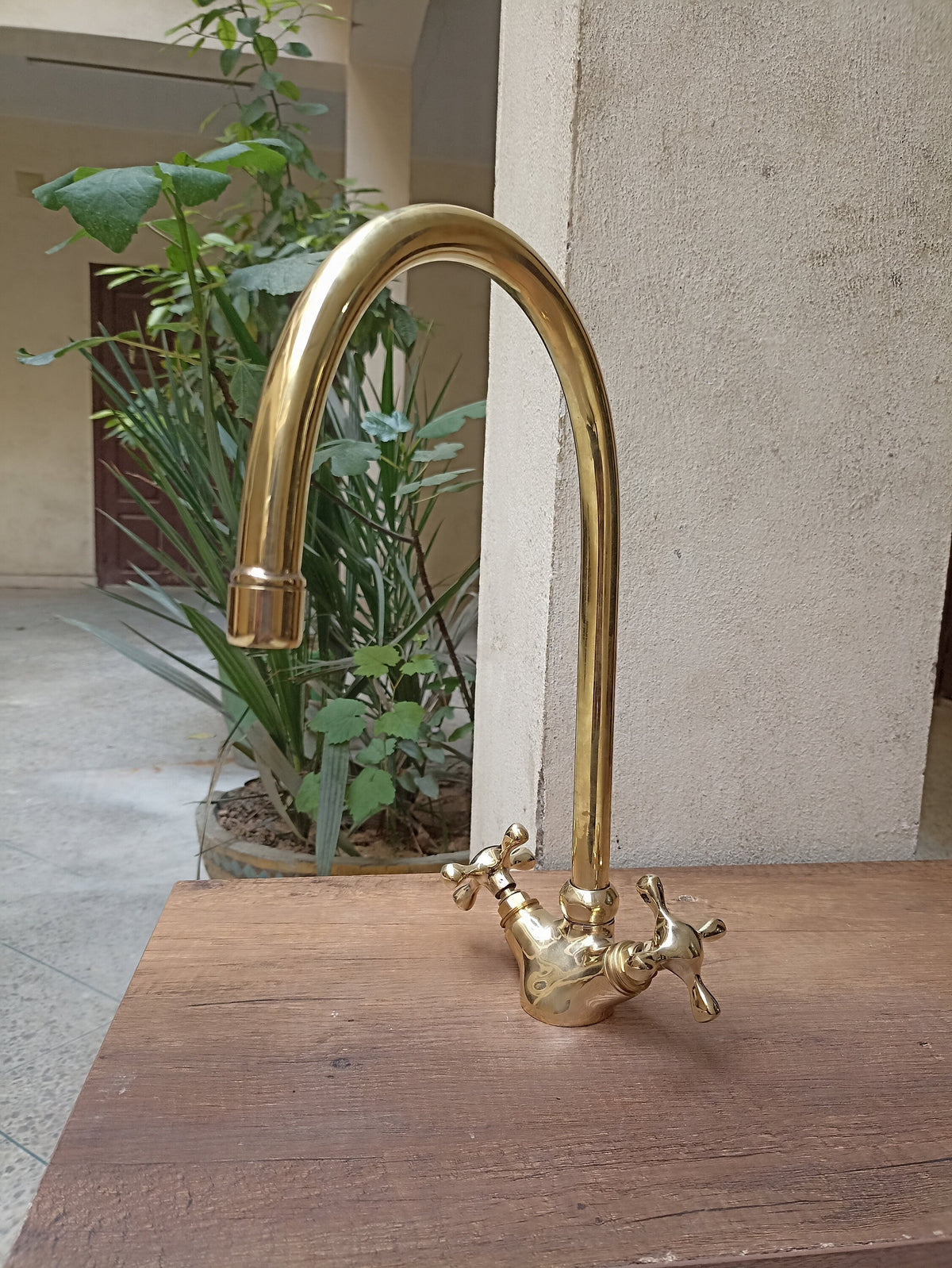 Brass gooseneck kitchen faucet
