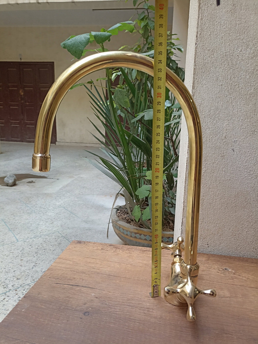 Brass gooseneck kitchen faucet