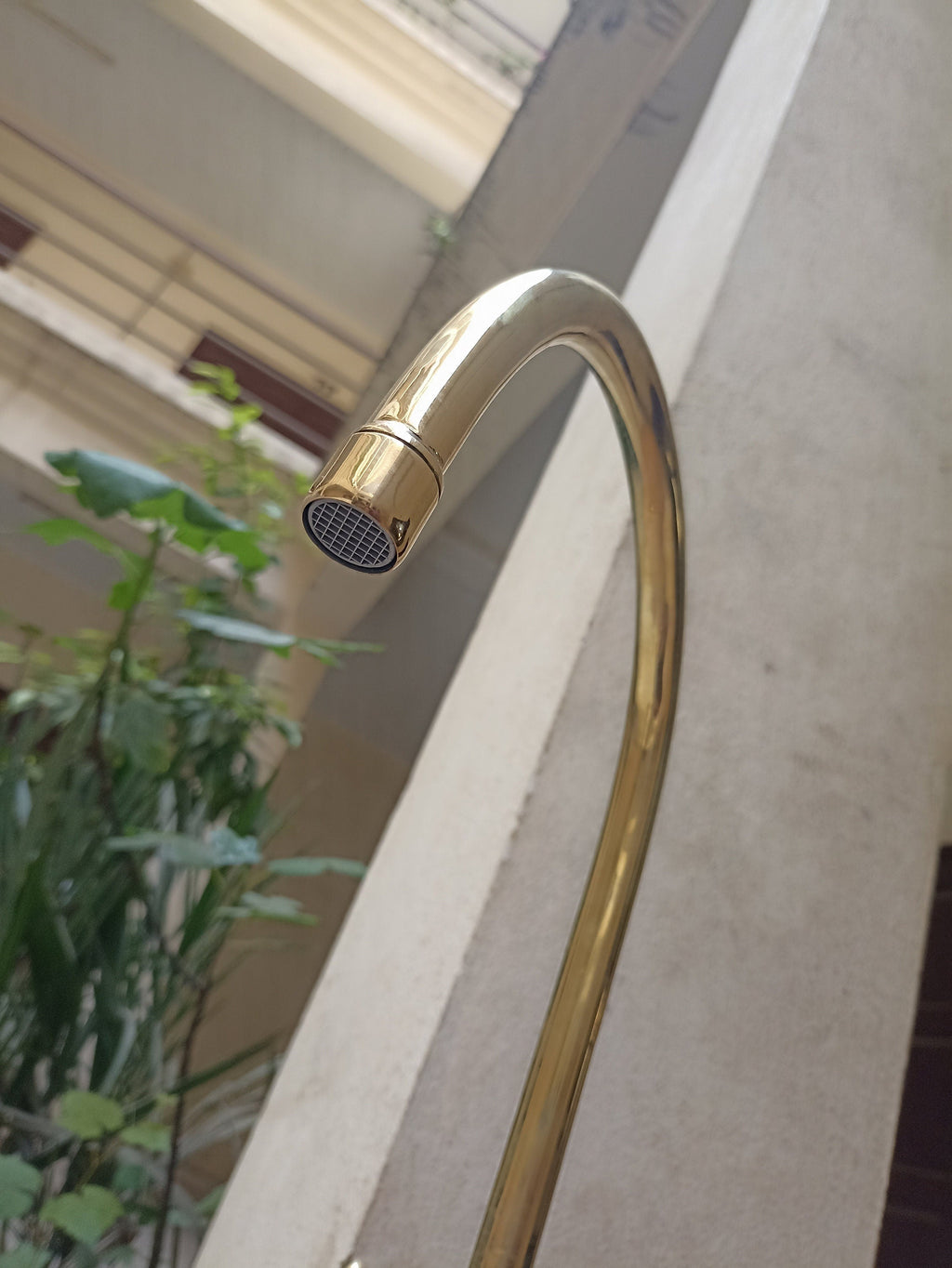 Brass gooseneck kitchen faucet