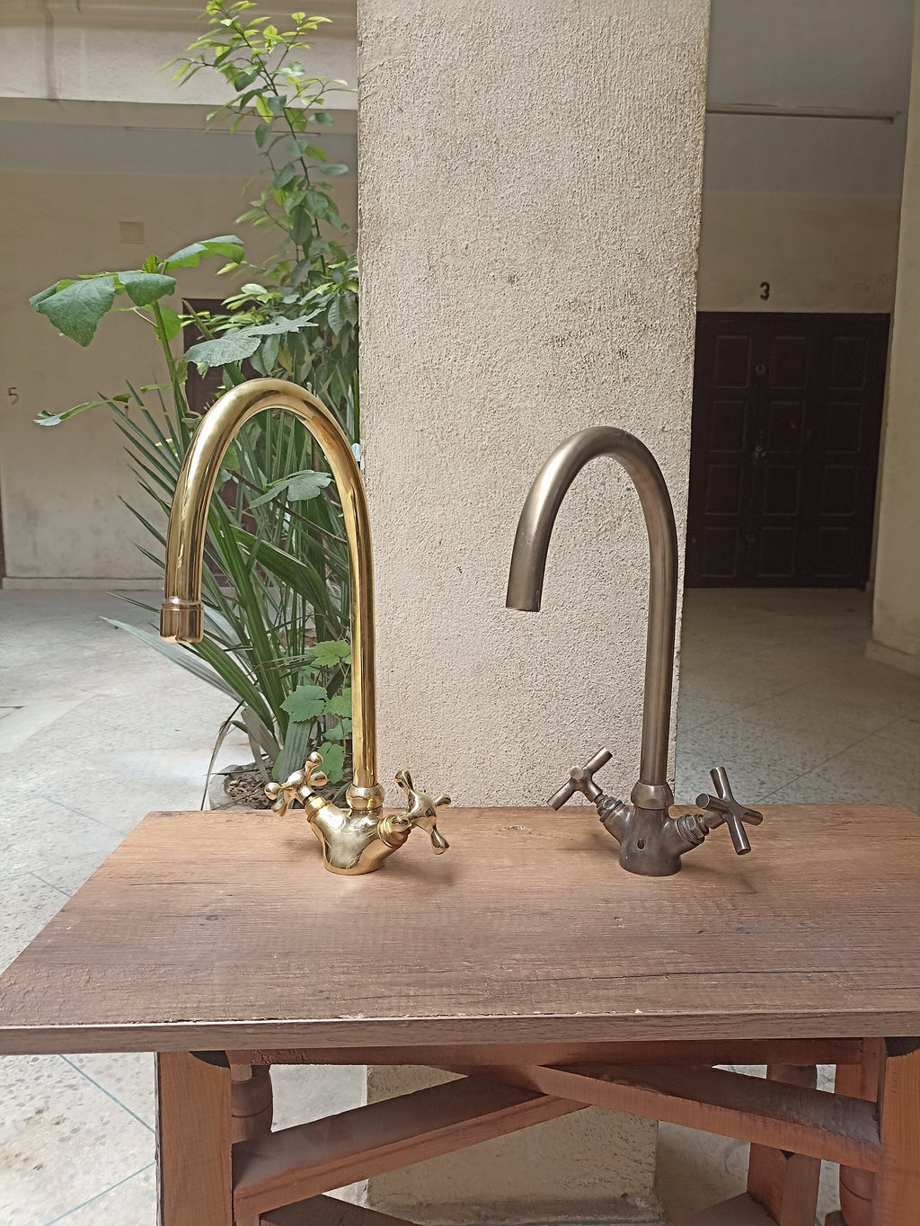 Brass gooseneck kitchen faucet