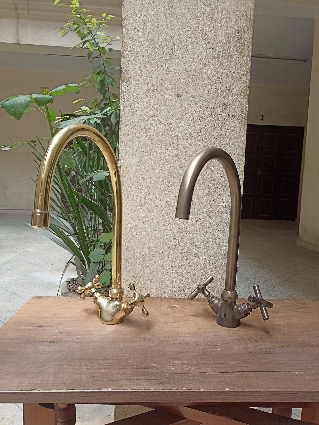 Brass gooseneck kitchen faucet