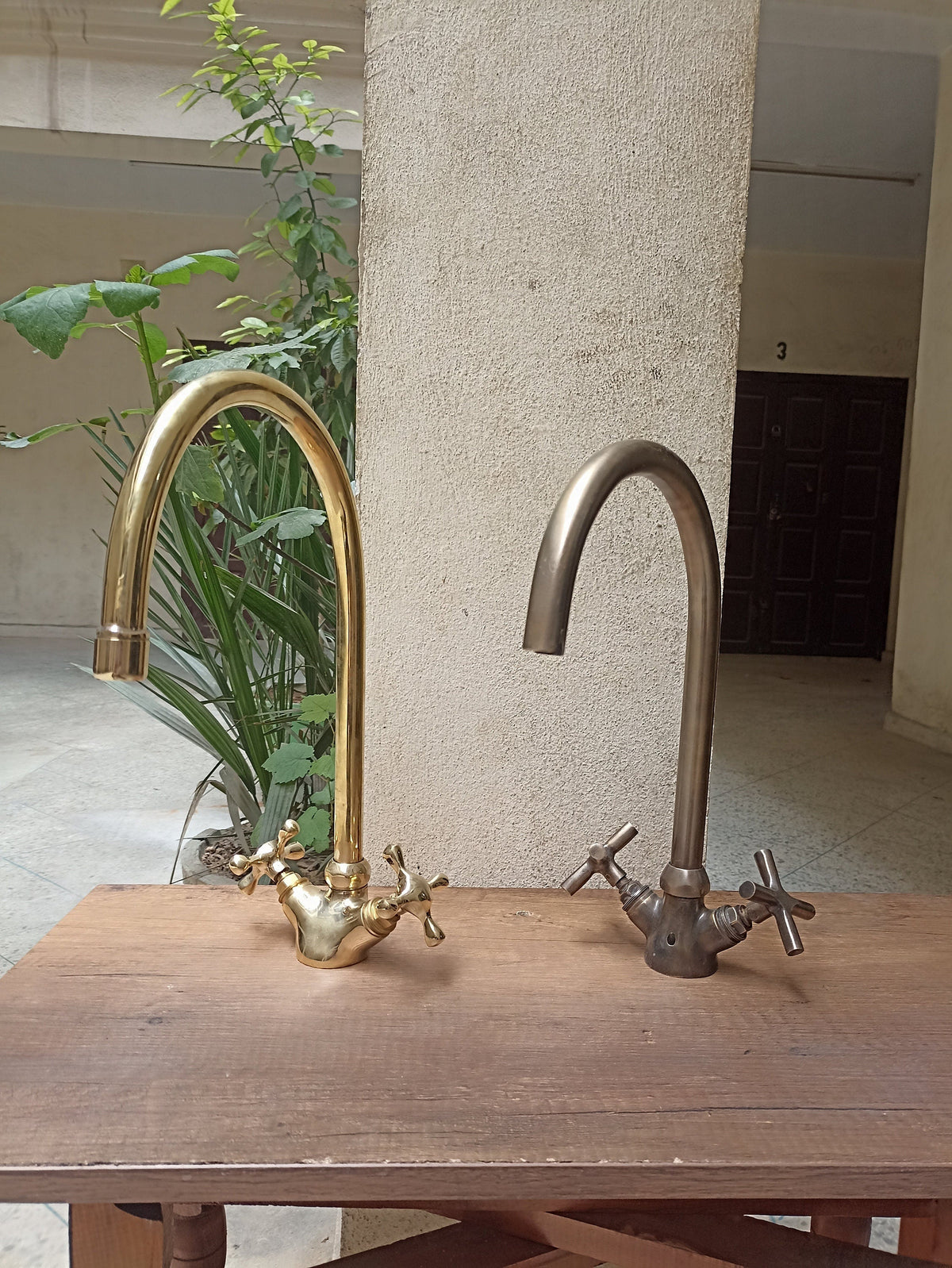Brass gooseneck kitchen faucet