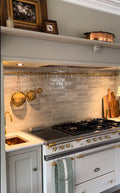 Unlacquered brass pot rail with brass "S" hooks. Solid brass