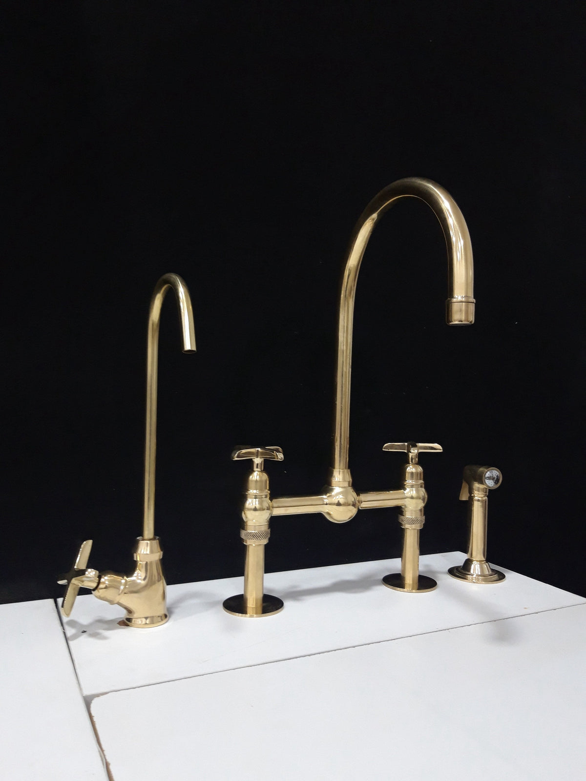 Unlaquered brass kitchen faucet