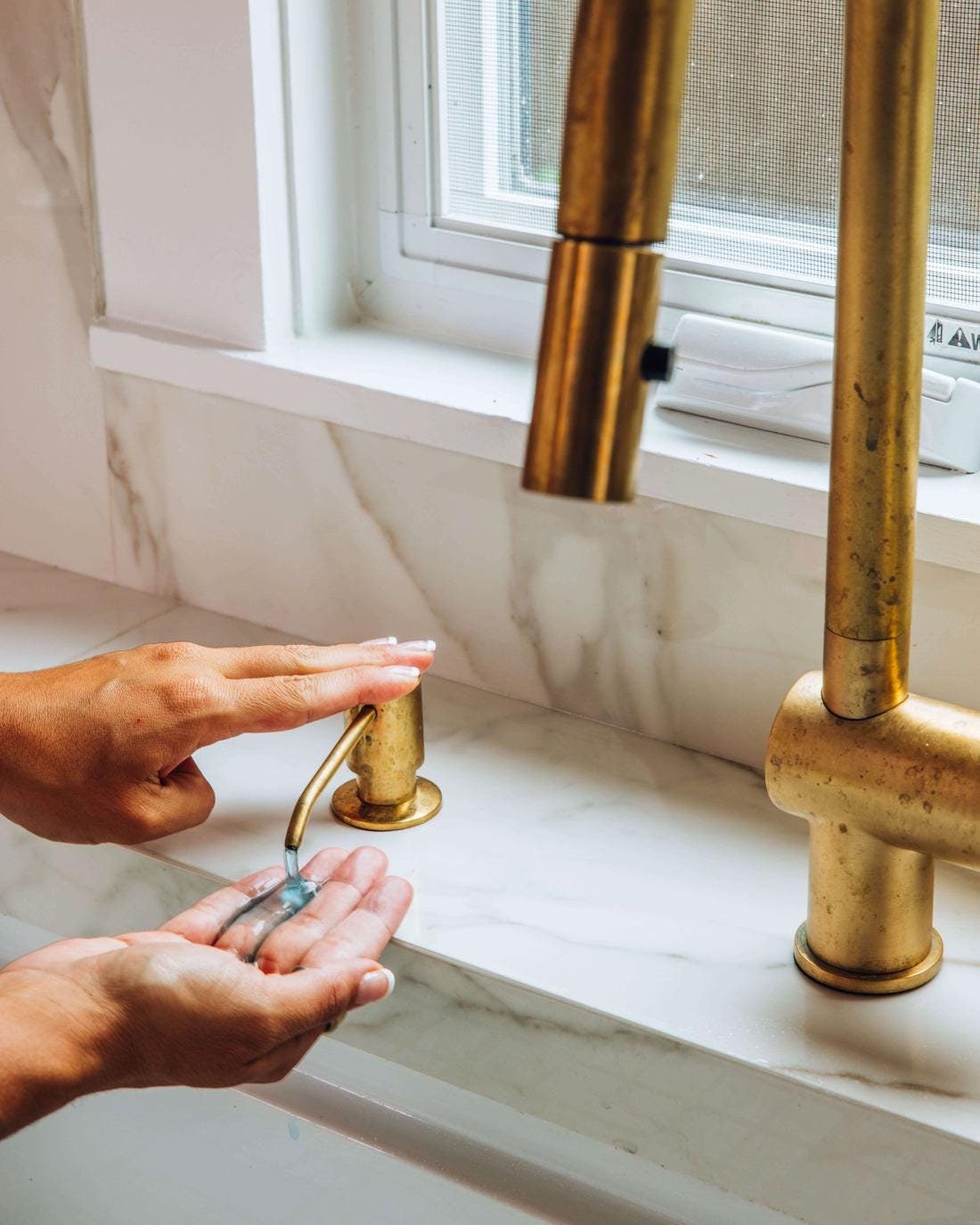 Solid brass soap dispenser