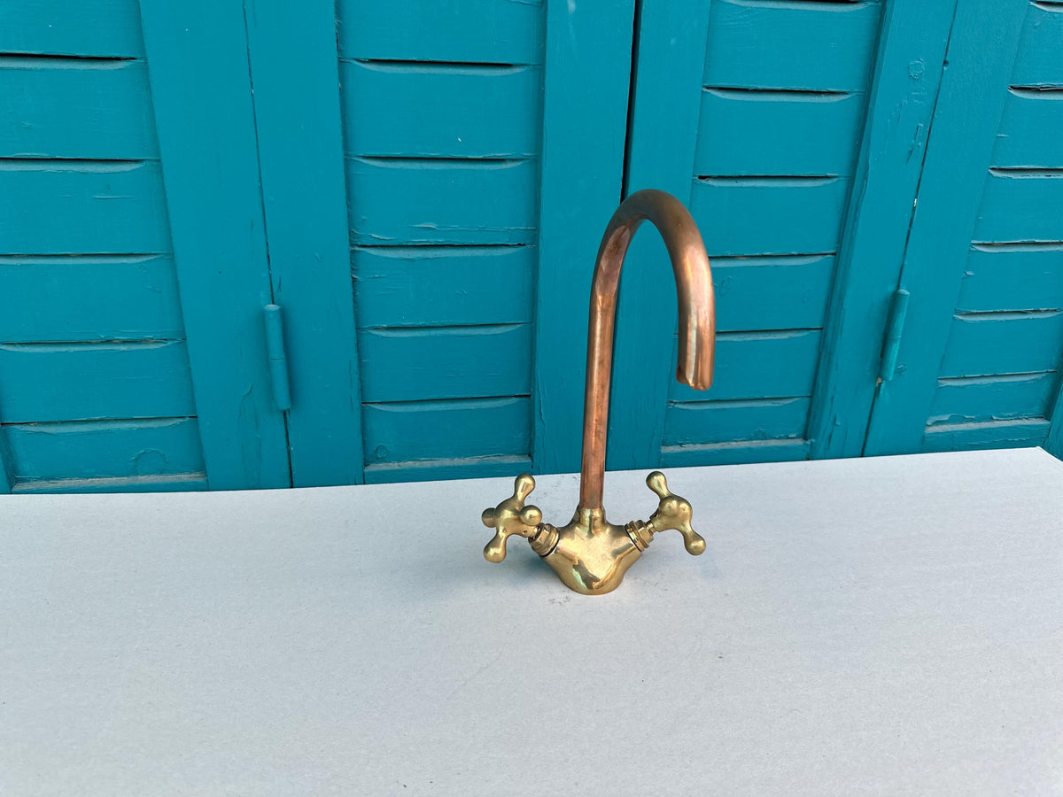 Copper faucet design with arc spout
