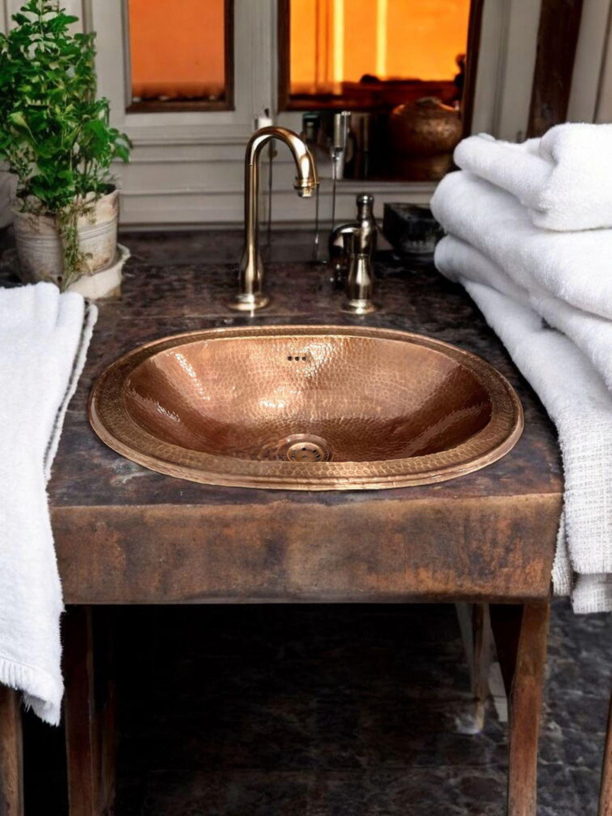 Oval Hammered Copper Drop-In Bathroom Sink with a Warm Copper Finish