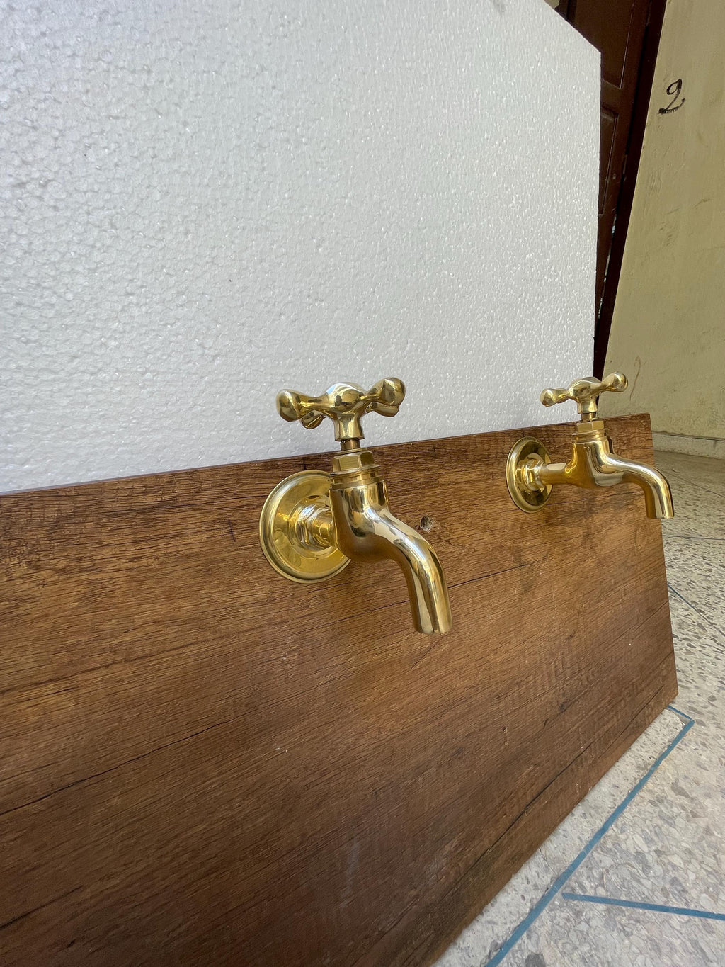 Unlacquered brass wall faucets - Unlacquered plain end faucet.