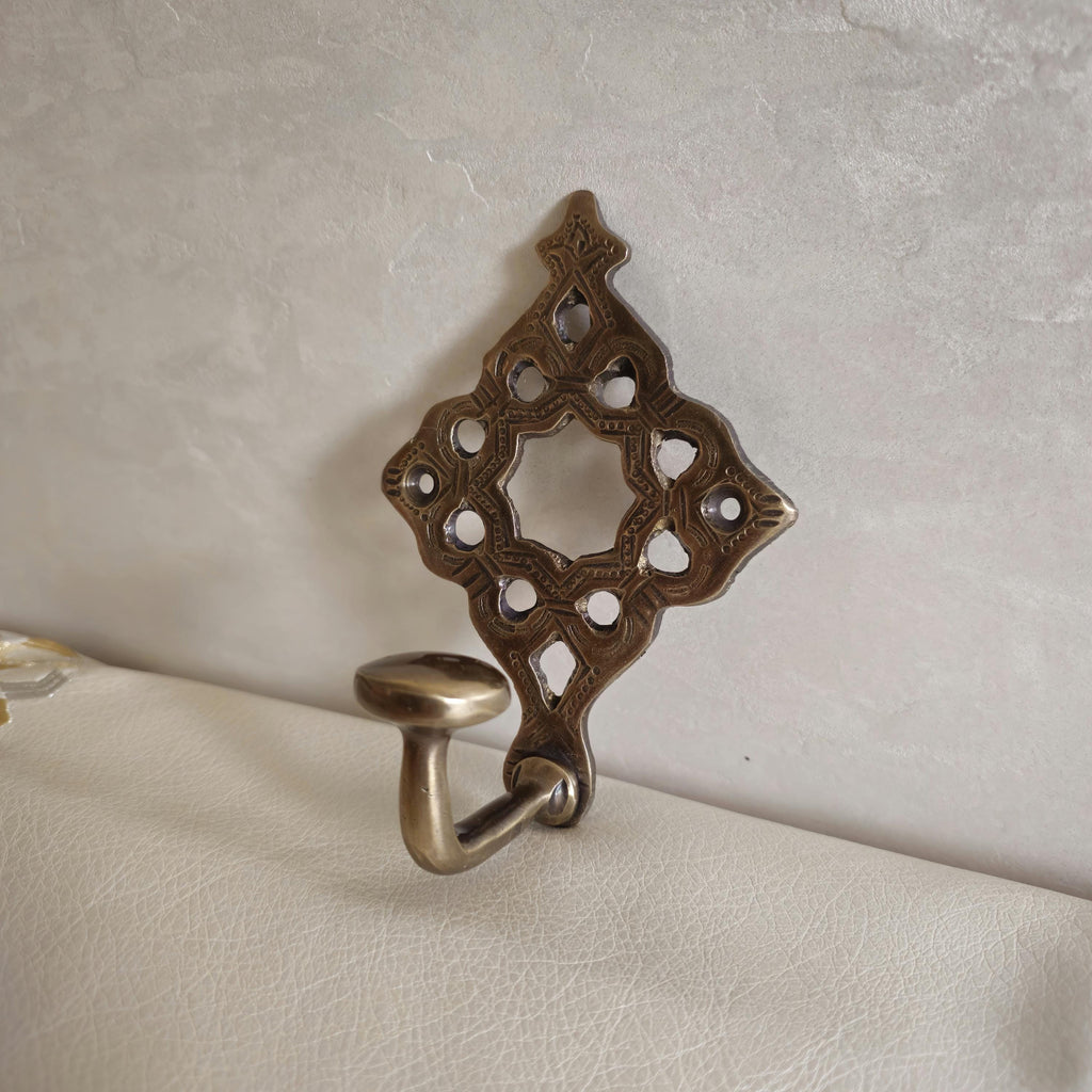 Pierced brass wall hook
