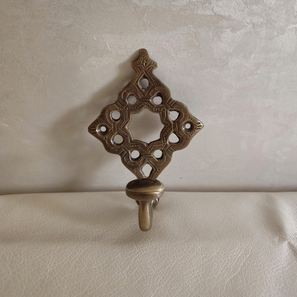 Pierced brass wall hook