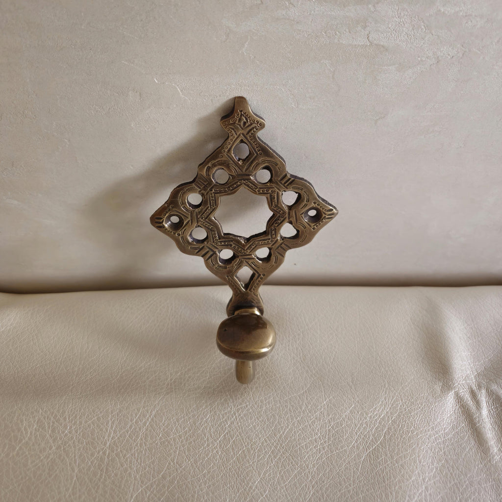 Pierced brass wall hook