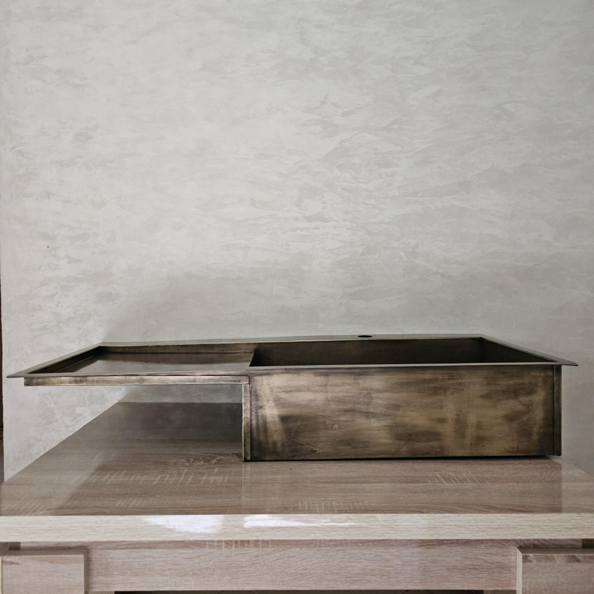 Brass sink with integrated drainboard