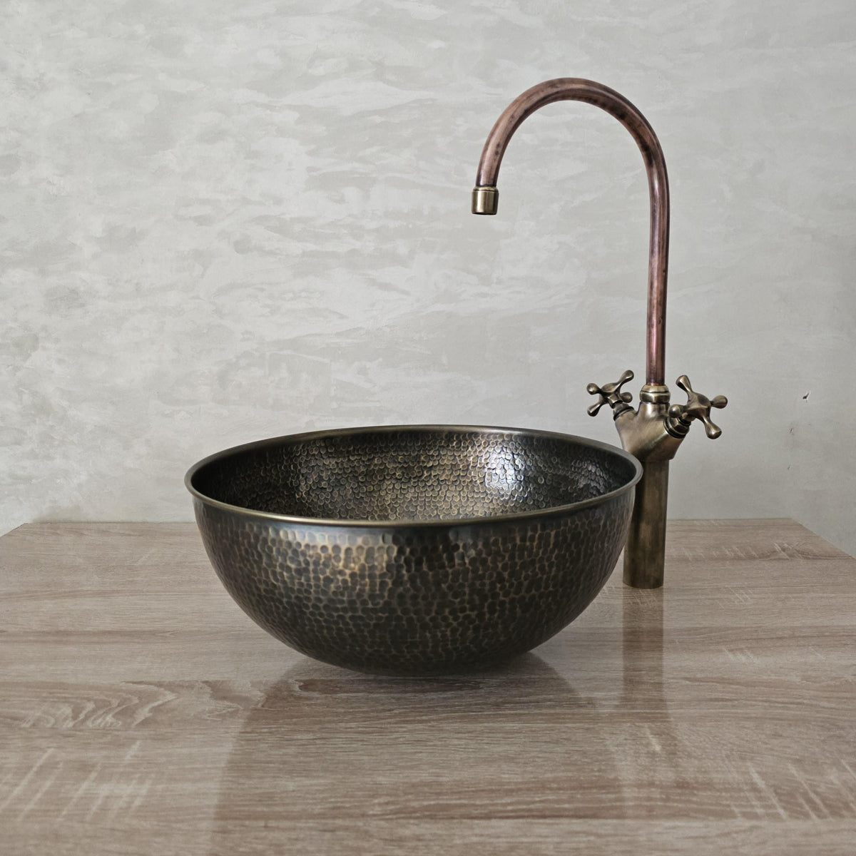 Hand-hammered patinated brass sink